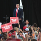 Illustration for article titled Watch: Trump Laughs During Rally When Supporter Suggests Shooting Migrants at the US-Mexico Border